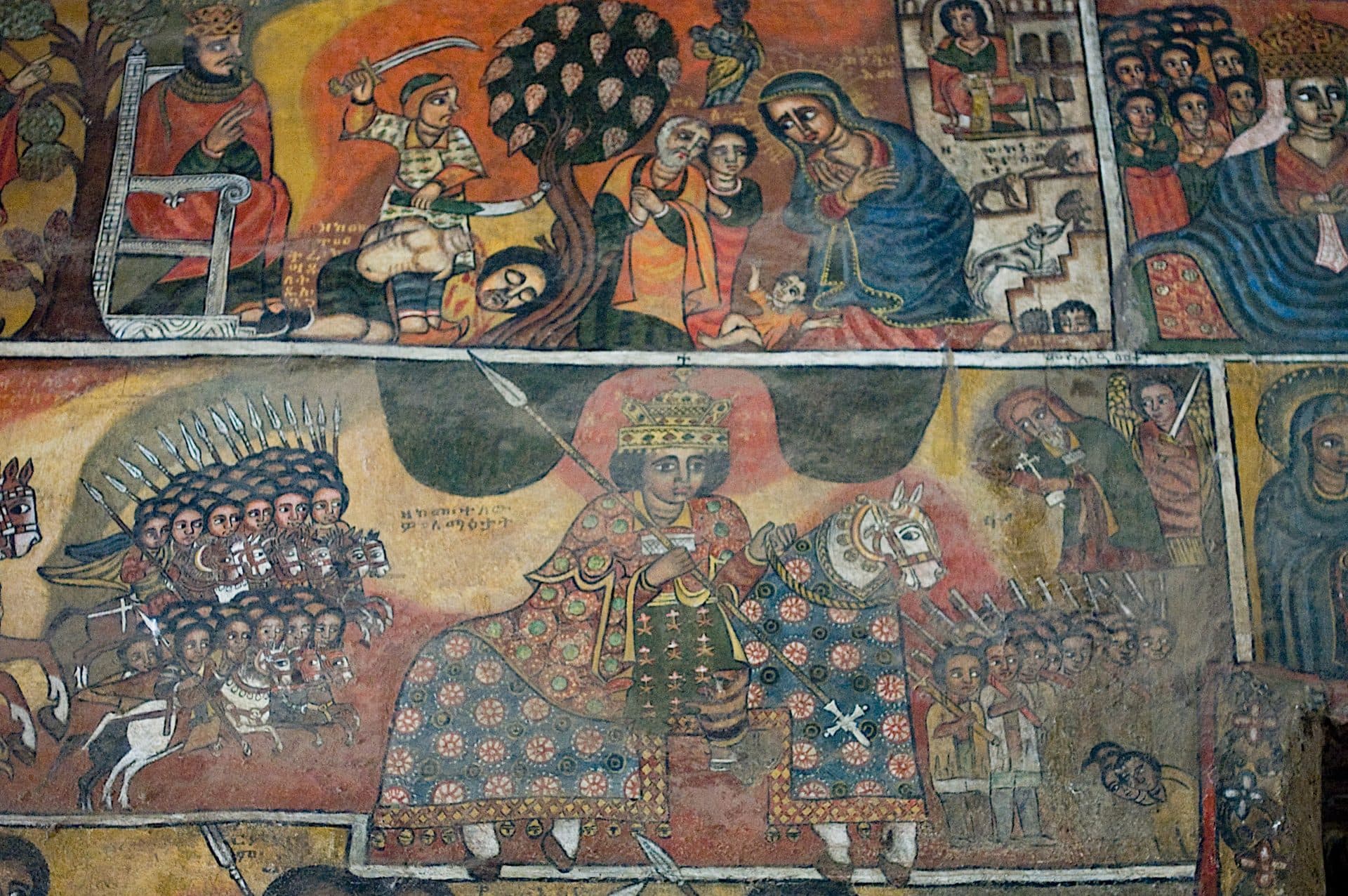 Rows of painted saints and riders on the wall of Debre Berhan Selassie church in Gondar