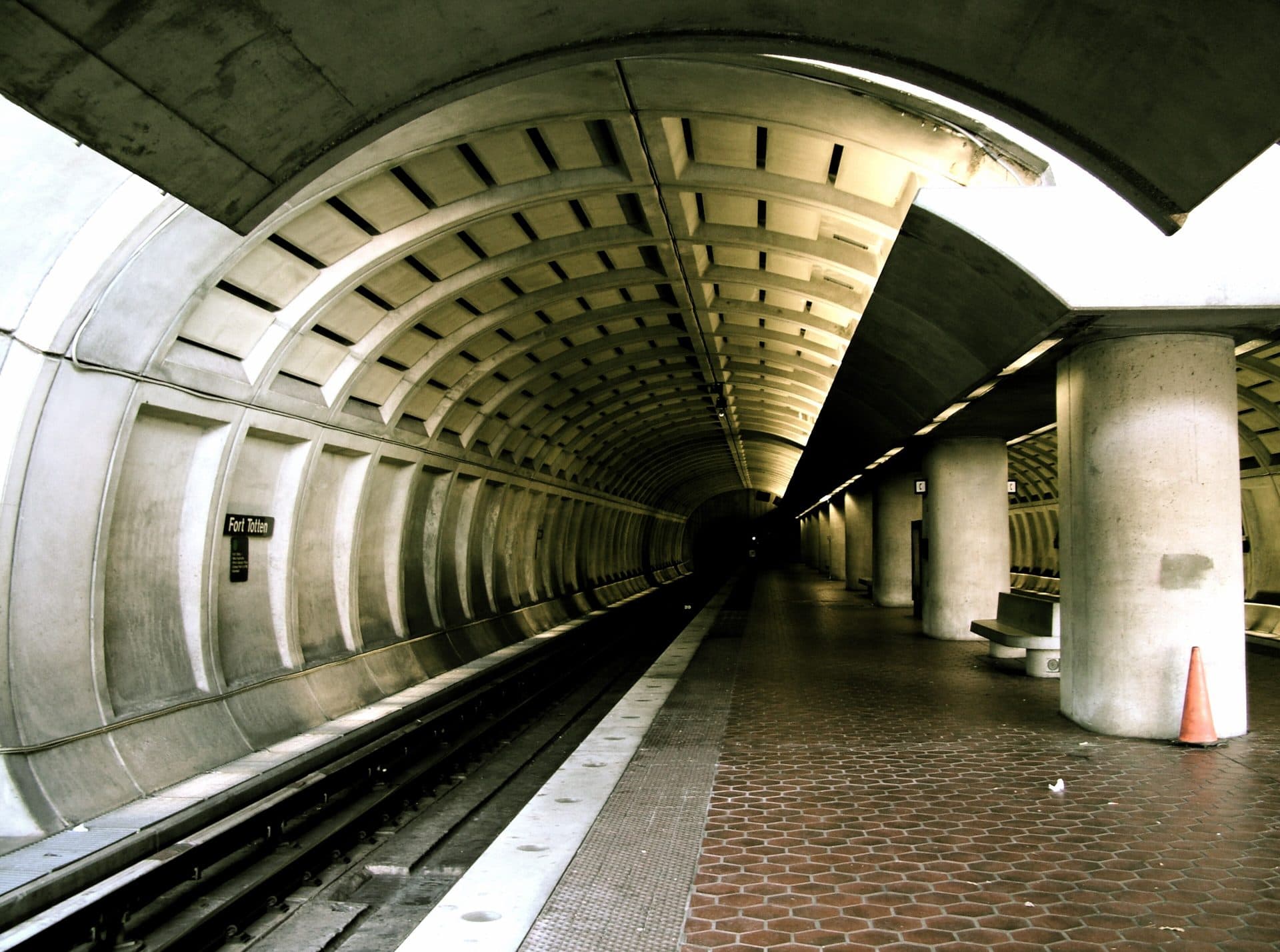 The vaulted concrete tunnel and platform of Fort Totten Metro station in Washington, D.C.
