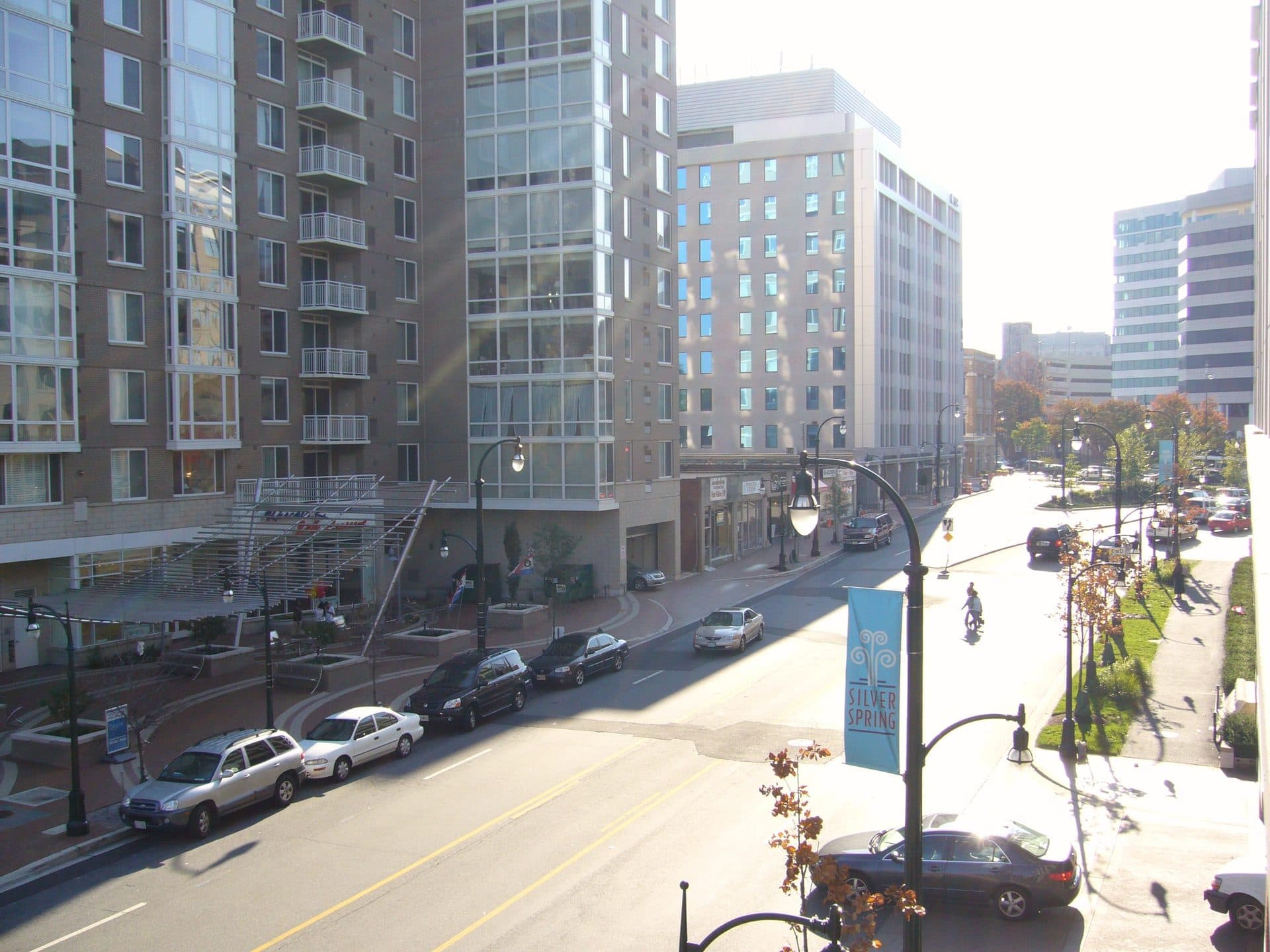 A wide street in downtown Silver Spring, Maryland, lined with apartment and office towers