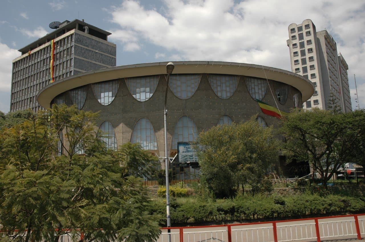 The modern headquarters of the Commercial Bank of Ethiopia in Addis Ababa behind palm trees